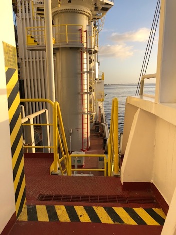 Walkway on deck showing the yellow and black hazard line