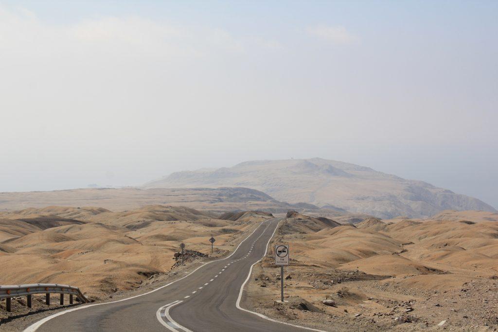 Chilean desert with road running through it.