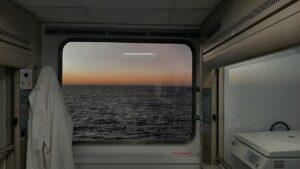 first light on the horizon through a window