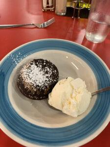 Chocolate lava cake in a bowl with ice cream