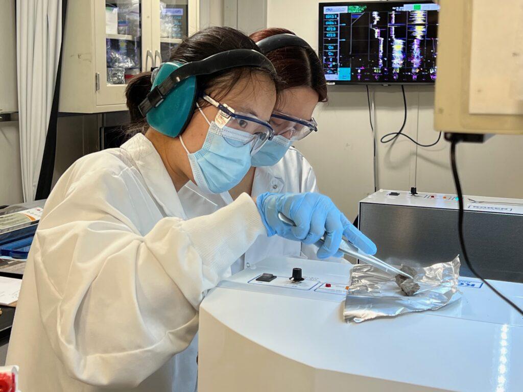 two scientists preparing samples