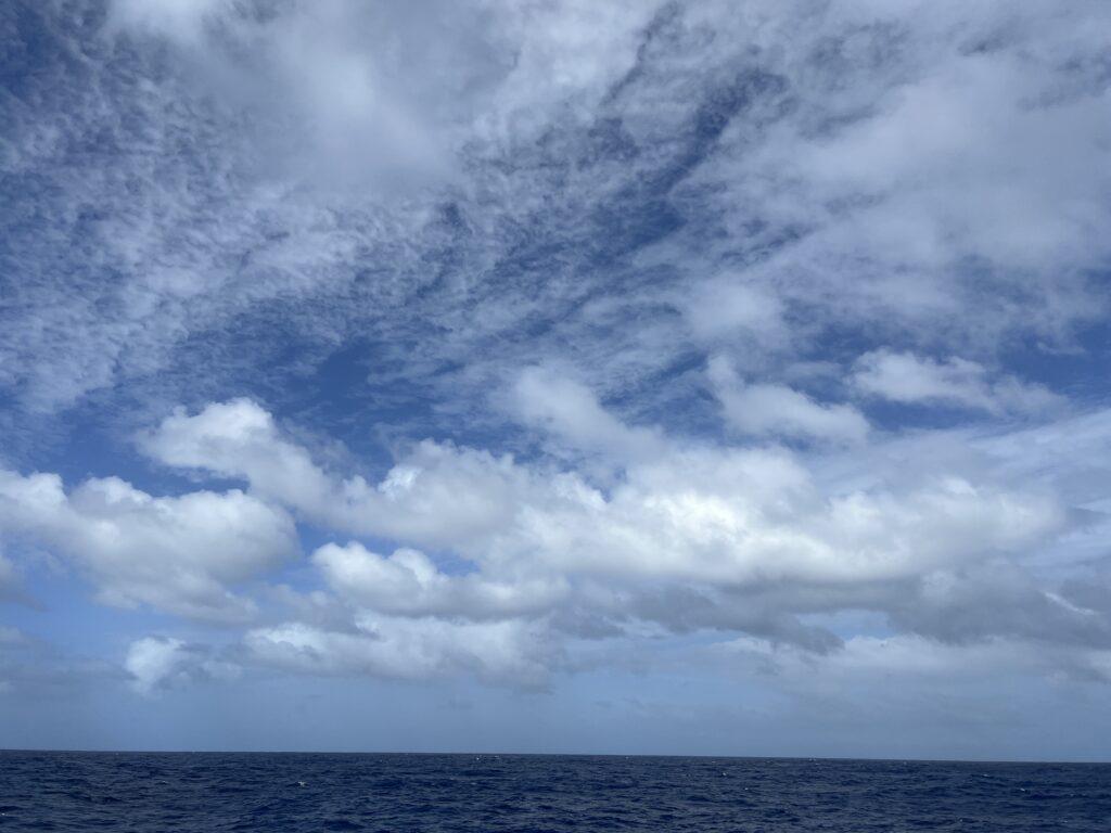 photo of clouds in sky over the ocean