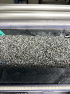 An image of a classic Walvis Ridge basalt core: fine-grained, dark gray, with flecks of white.