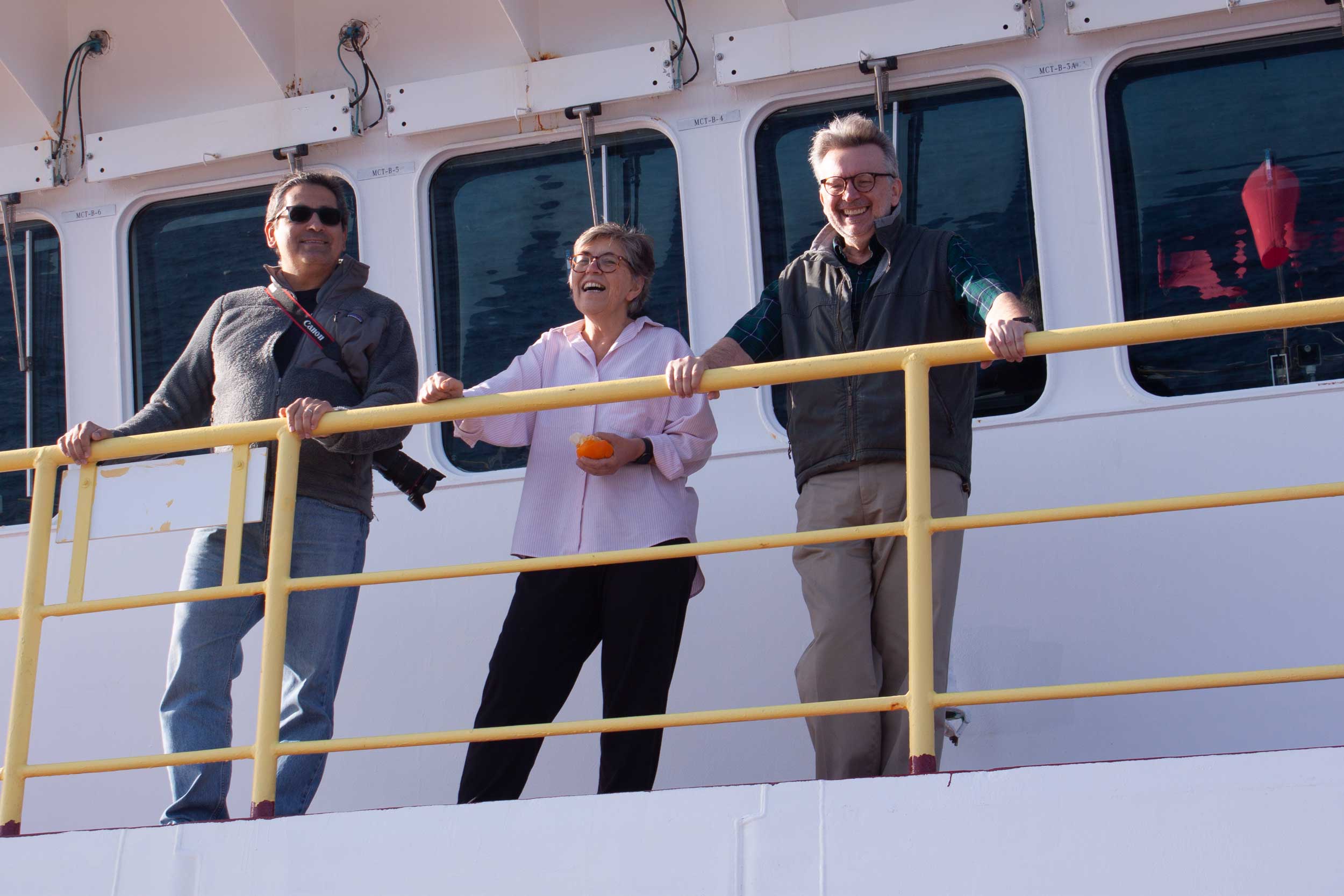 The three leaders of Exp. 397 on the ship's deck.